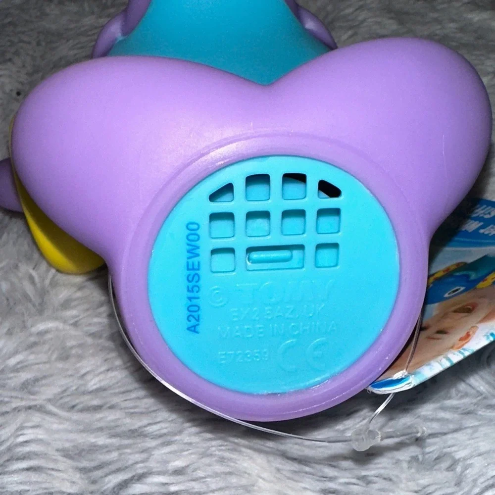 TOMY Water Whistlers Purple Dolphin Bath Toy E72379 Squirter Whistle 9m+